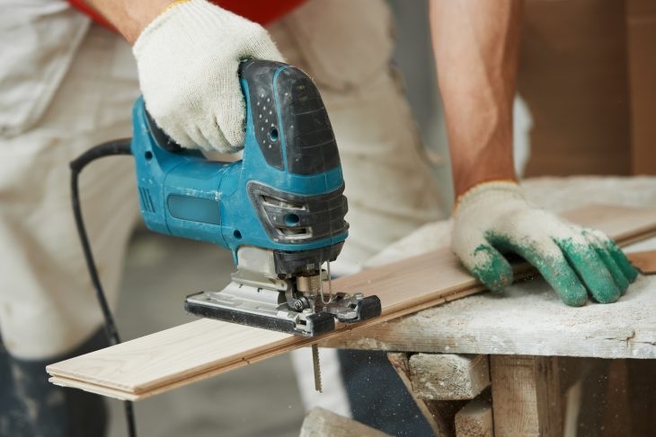 Cutting parquet board with jigsaw